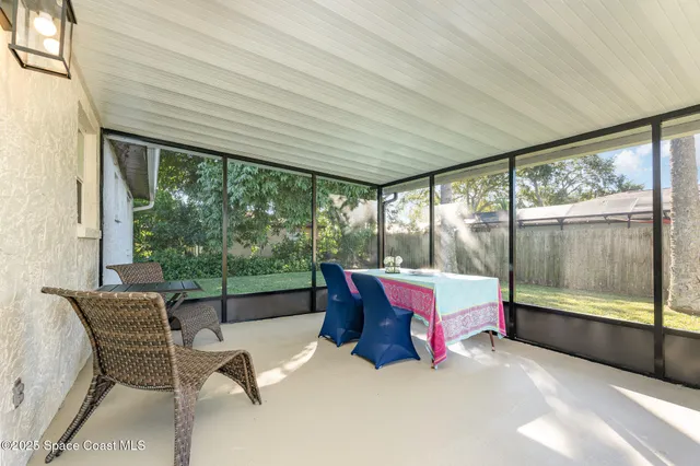 a view of backyard with swimming pool and porch