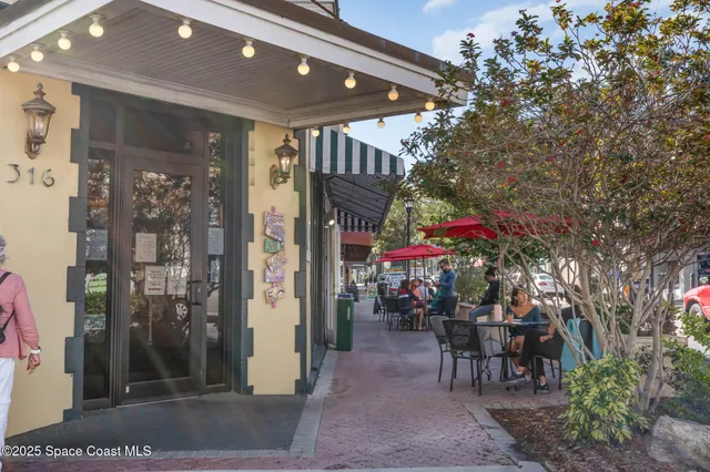a view of a lake with a table and chairs
