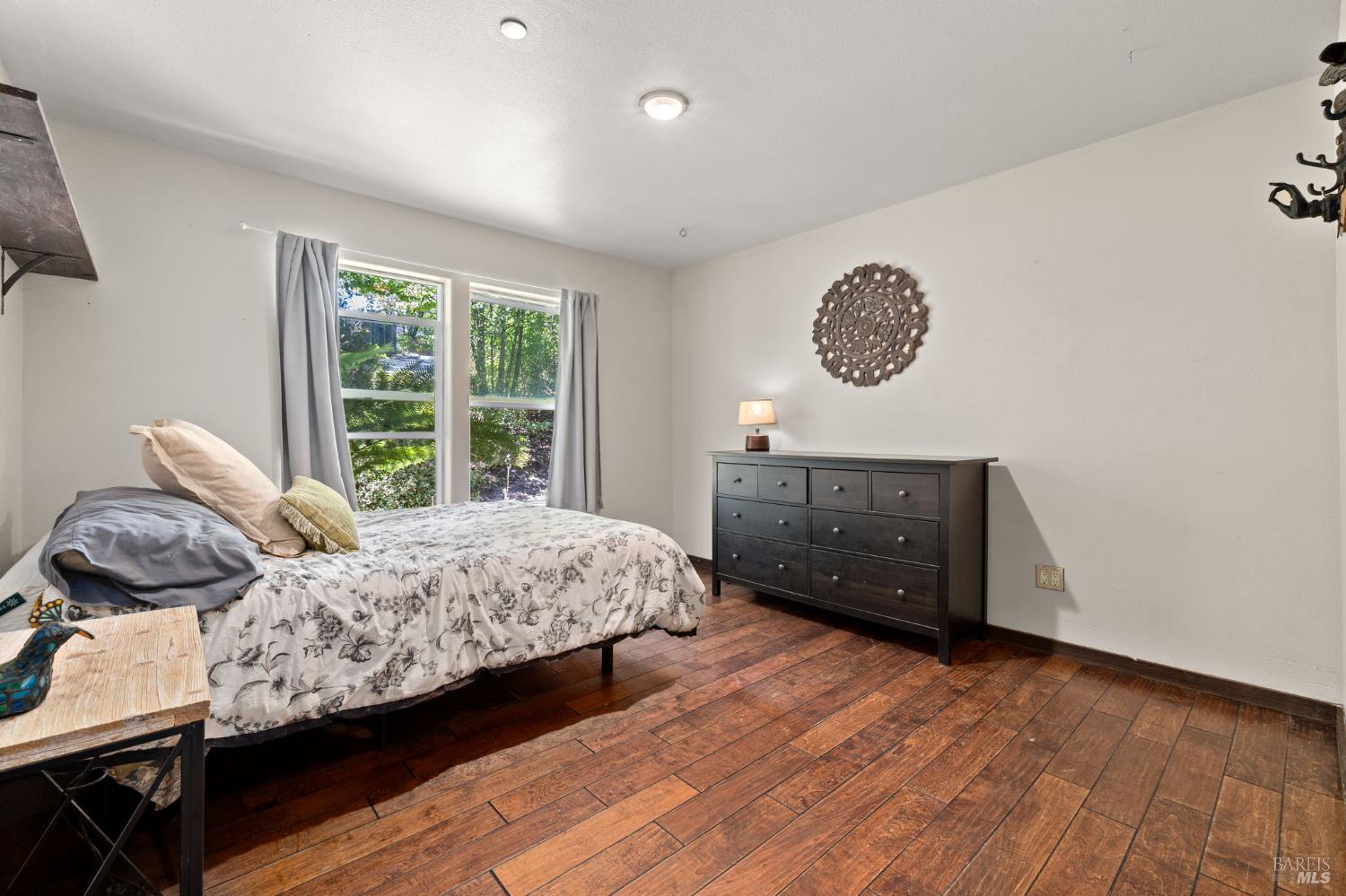 9935 Occidental Road Sebastopol, CA 95472 - Photo 12 of 53 The first of two bedrooms on the main floor