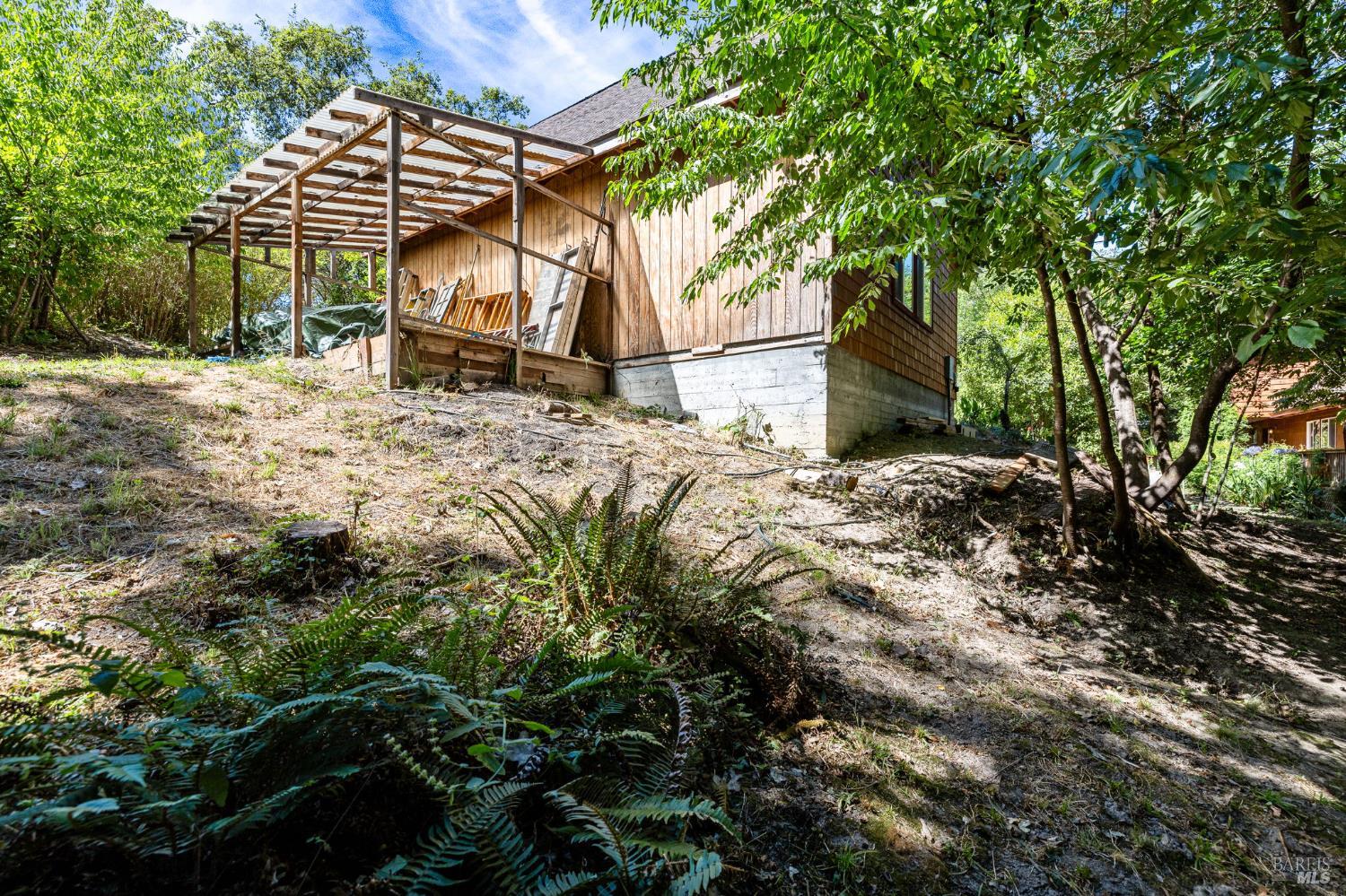 9935 Occidental Road Sebastopol, CA 95472 - Photo 40 of 53 The back of the garage, which offers some covered storage space