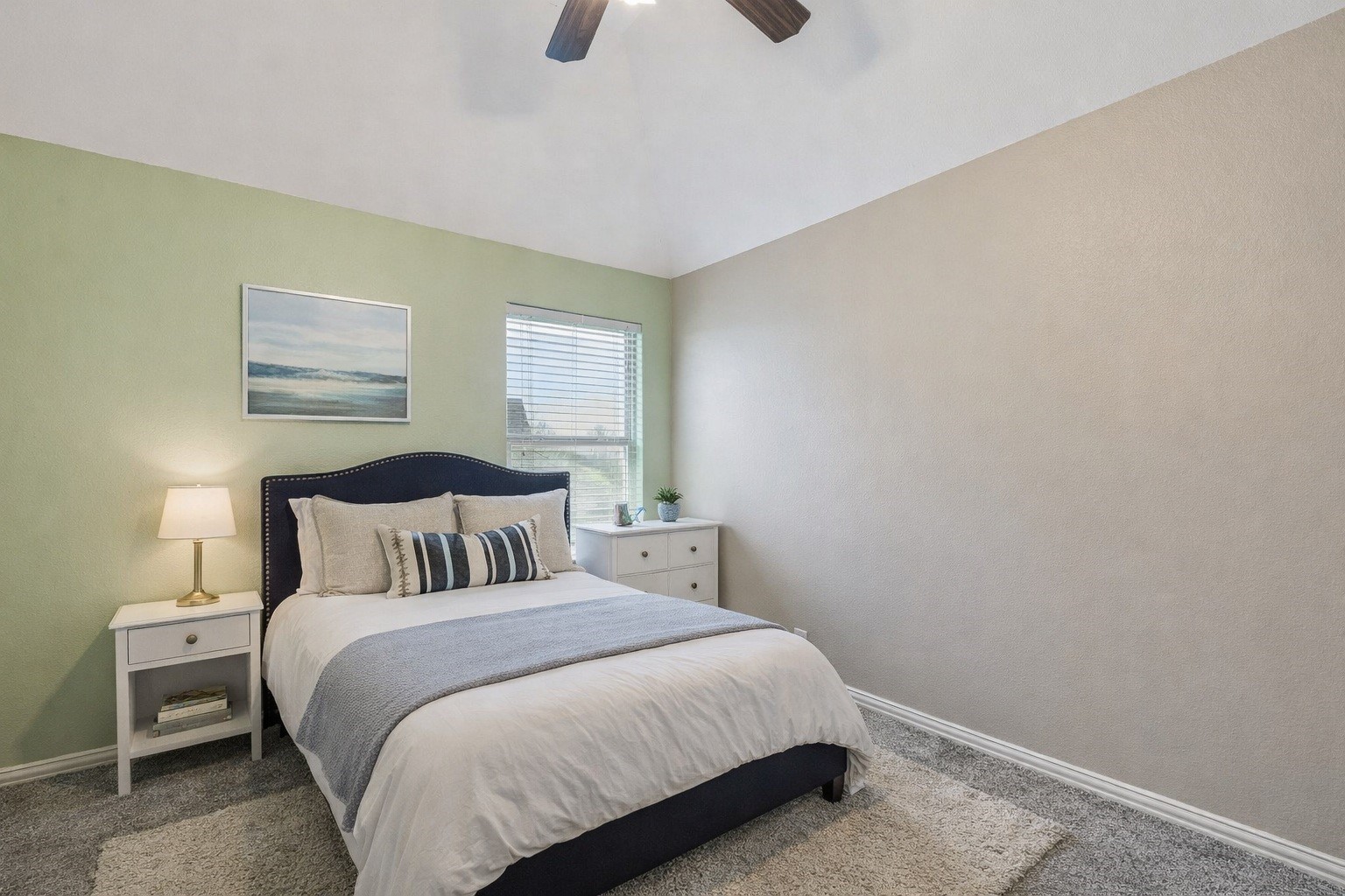 29918 Valley Terrace Drive Fulshear, TX 77406 - Photo 20 of 27 Another spacious secondary bedroom showcases a cheerful accent wall and a large window. Virtually staged so you can imagine the possibilities.