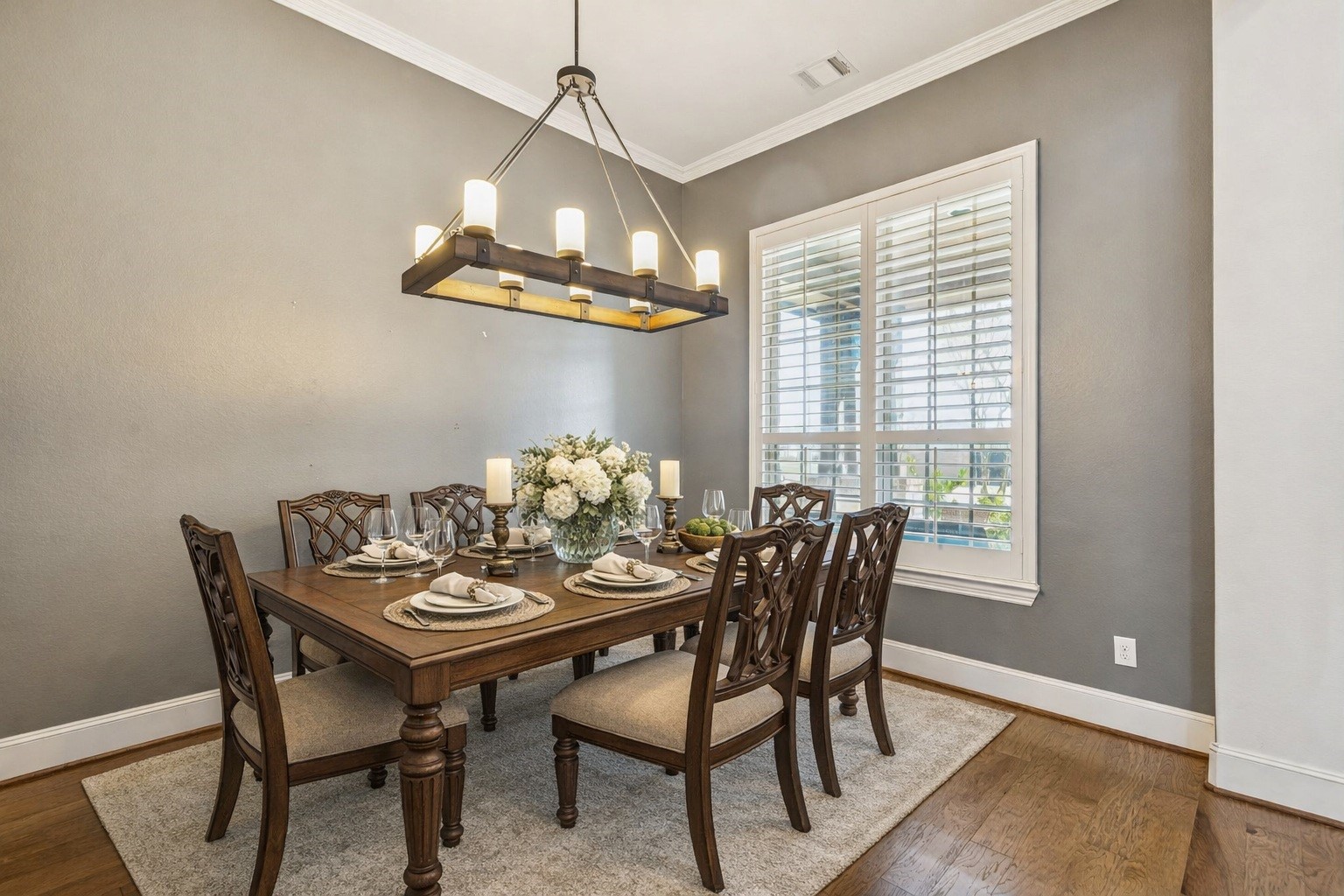 29918 Valley Terrace Drive Fulshear, TX 77406 - Photo 4 of 27 The dining area features beautiful shutters and elegant designer lighting. It is the perfect setting for holiday gatherings or intimate dinners. Virtually staged so you can imagine the possibilities.