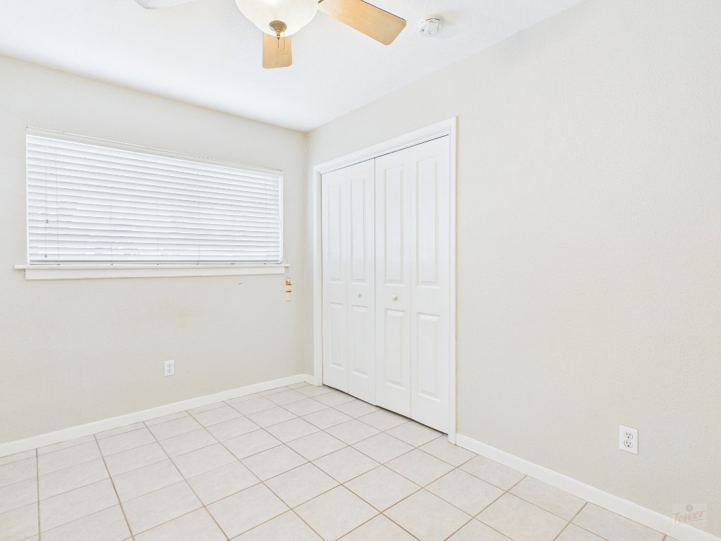 304 East 33rd Street, Unit 10 Austin, TX 78705 - Photo 12 of 28 an empty room with windows