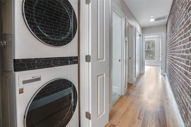 a view of a hallway with washer and dryer