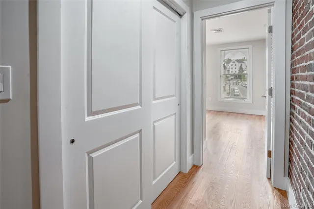 a view of a hallway with a white walls