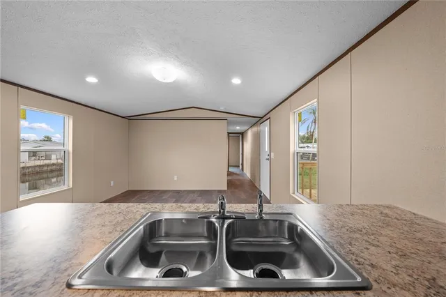 a kitchen with a sink and a window