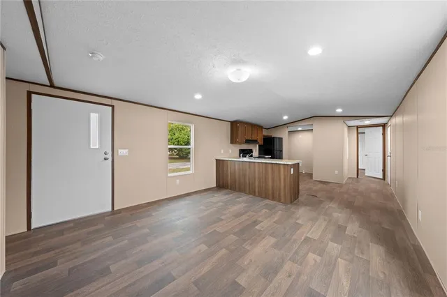 a view of a kitchen with a sink and a window