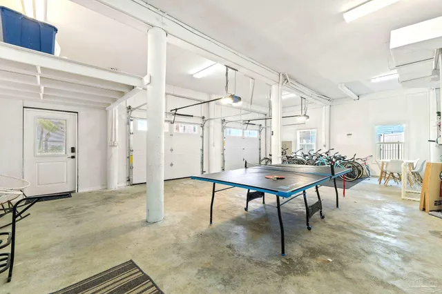 an aerial view of a house with swimming pool garden and patio