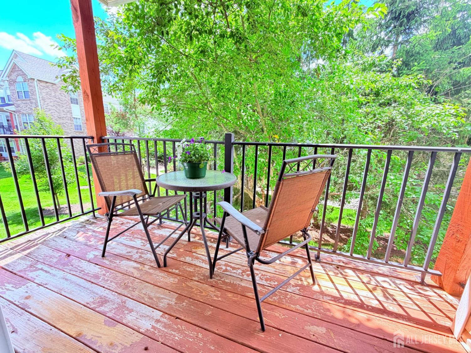 918 Plymouth Road North Brunswick, NJ 08902 - Photo 28 of 30 a view of a chair and table on the roof deck