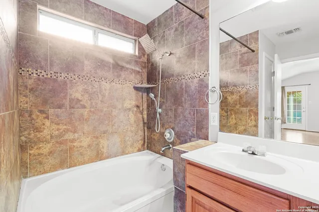 a bathroom with a sink and a bathtub