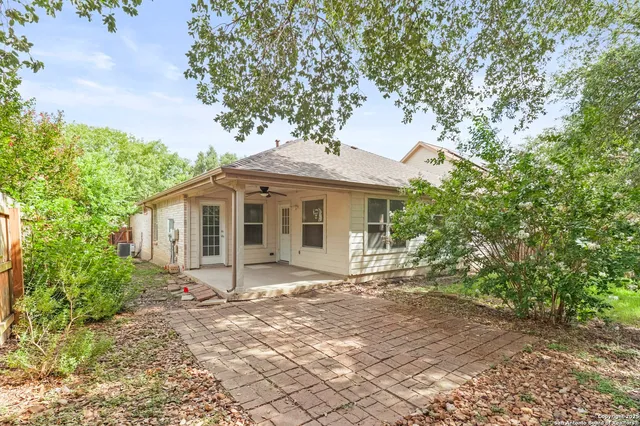 a view of a house with a tree in a yard