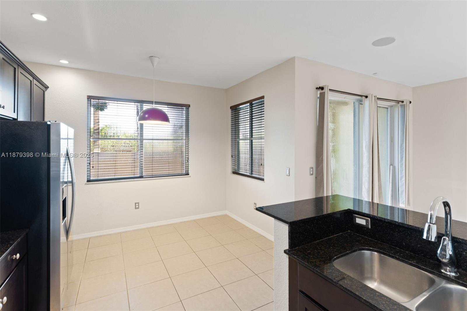 9035 Southwest 17th Court Miramar, FL 33025 - Photo 16 of 39 a bathroom with a sink and a mirror