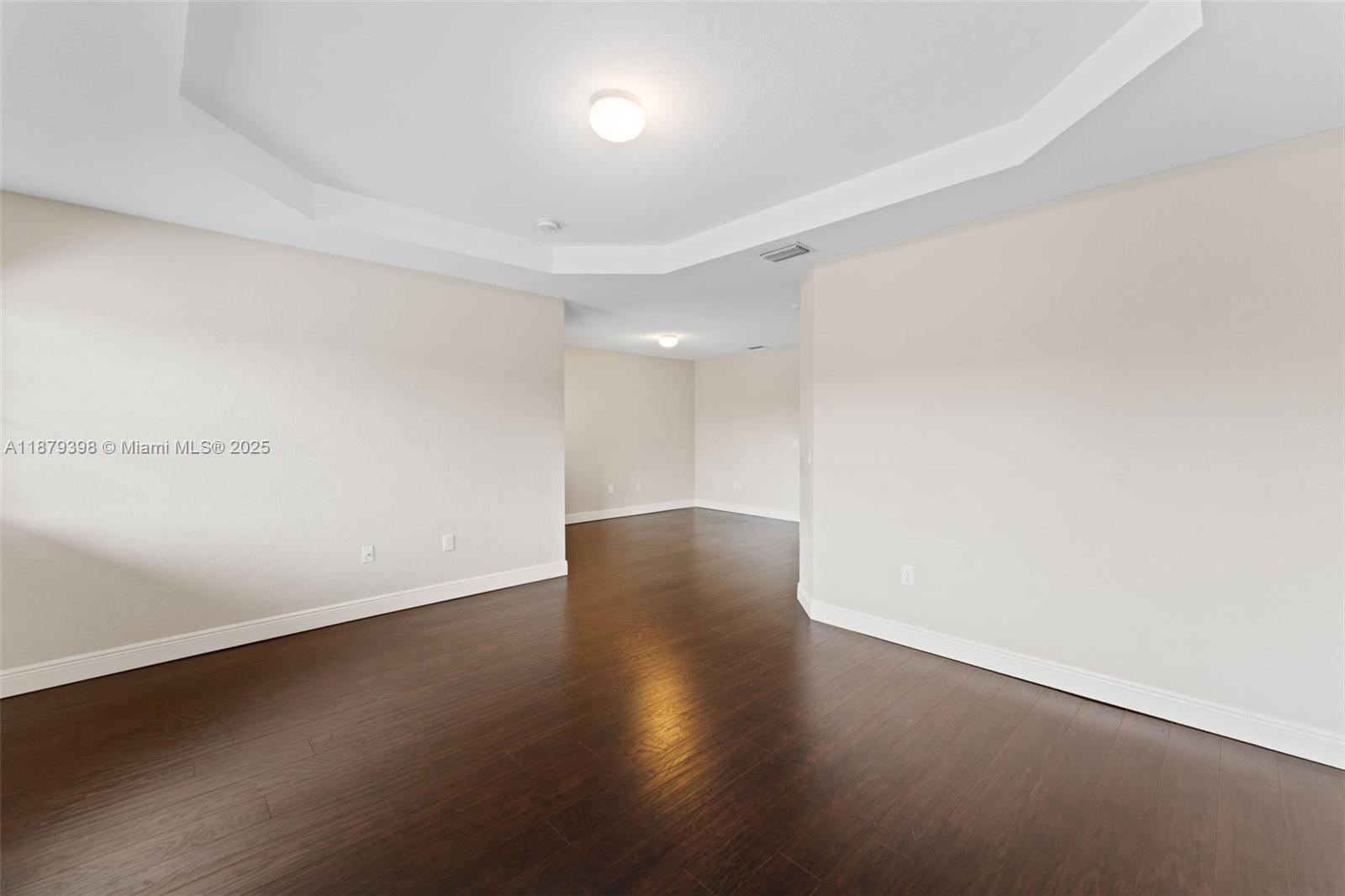 9035 Southwest 17th Court Miramar, FL 33025 - Photo 23 of 39 an empty room with wooden floor and windows