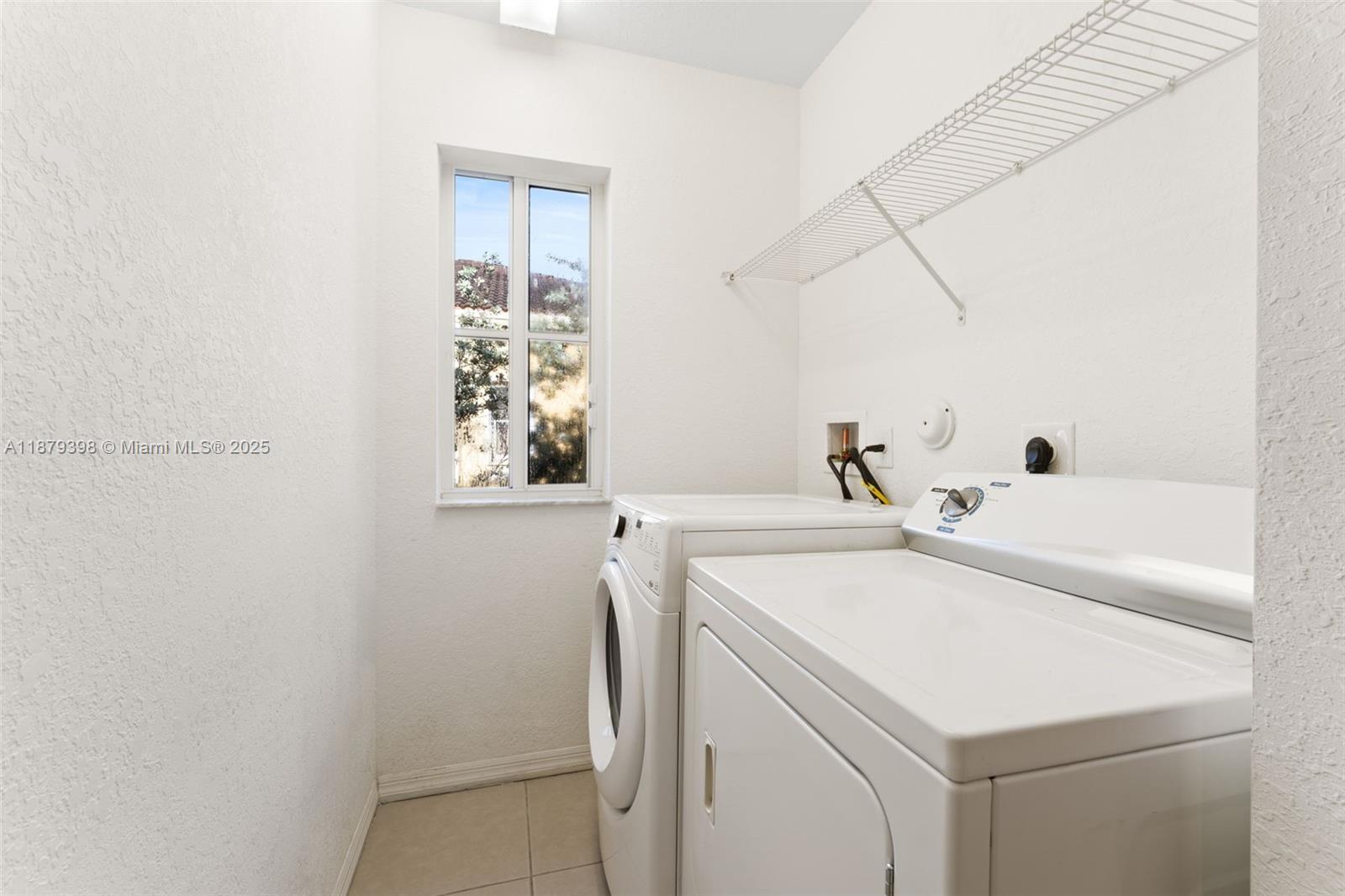 9035 Southwest 17th Court Miramar, FL 33025 - Photo 31 of 39 a utility room with dryer and washer