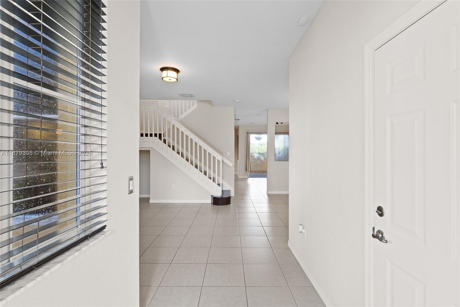 9035 Southwest 17th Court Miramar, FL 33025 - Photo 4 of 39 a view of a hallway with staircase