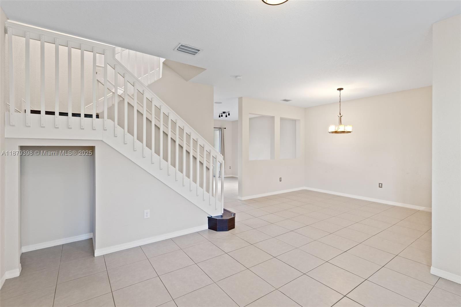 9035 Southwest 17th Court Miramar, FL 33025 - Photo 6 of 39 a view of an entryway with wooden floor