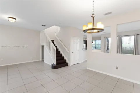 a view of entryway and hall with a window