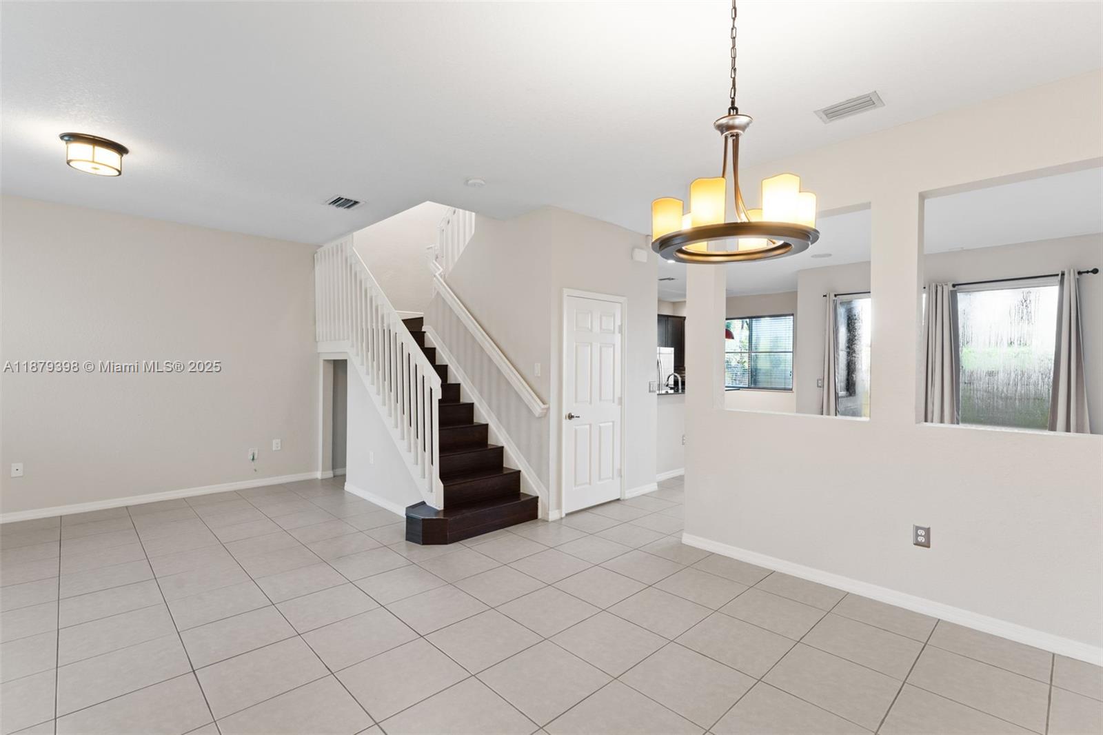 9035 Southwest 17th Court Miramar, FL 33025 - Photo 7 of 39 a view of entryway and hall with a window