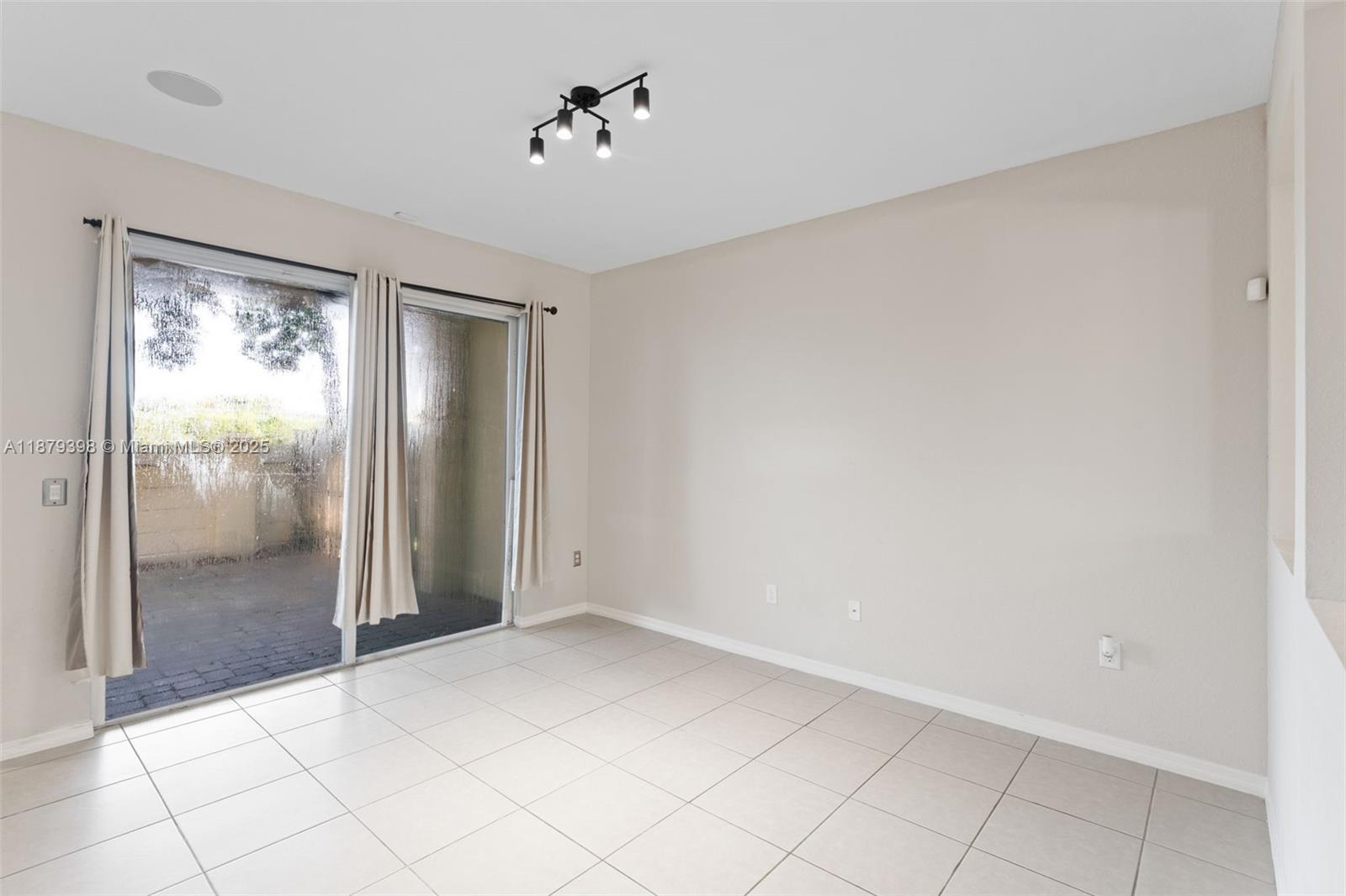 9035 Southwest 17th Court Miramar, FL 33025 - Photo 9 of 39 a view of an empty room and window