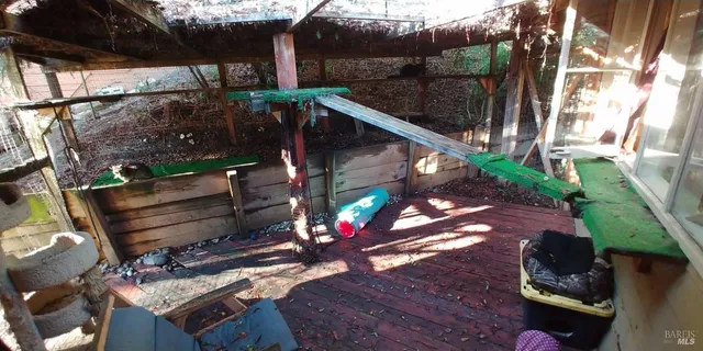 a view of balcony with wooden floor