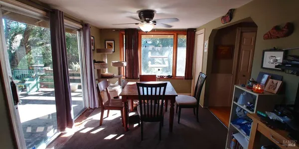 a view of a dining room with furniture window and outside view