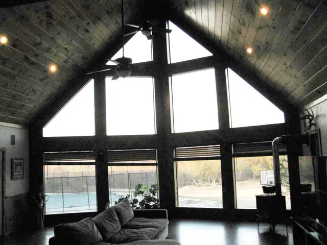 a living room with large windows