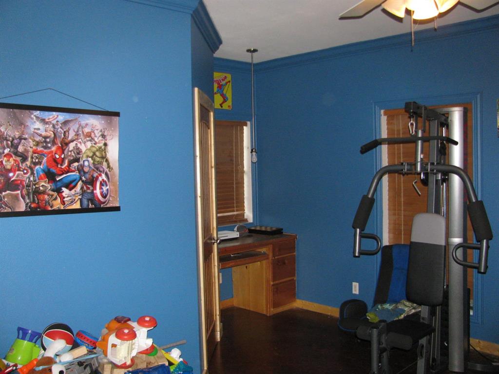 941 North 4420th Road Valliant, OK 74764 - Photo 15 of 40 a bedroom with a bed and a window