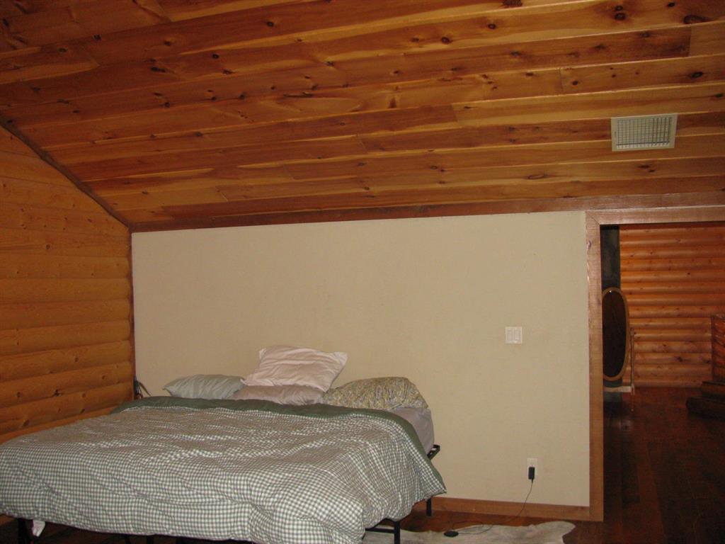 941 North 4420th Road Valliant, OK 74764 - Photo 21 of 40 a bedroom with a bed and a window