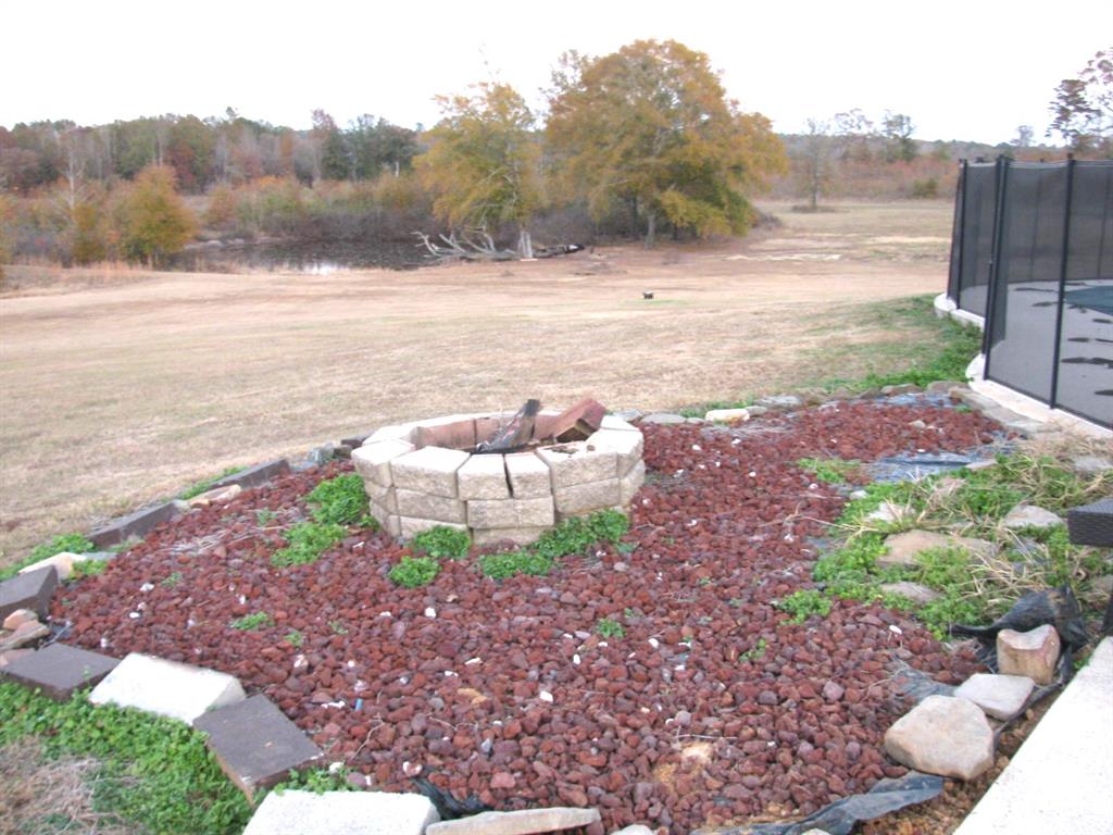 941 North 4420th Road Valliant, OK 74764 - Photo 30 of 40 a view of a yard with an outdoor space