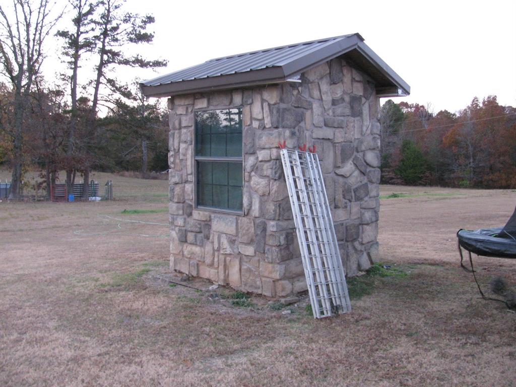 941 North 4420th Road Valliant, OK 74764 - Photo 38 of 40 a view of a house with a yard