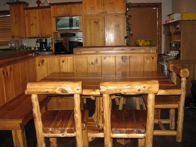 a kitchen with granite countertop a stove and cabinets