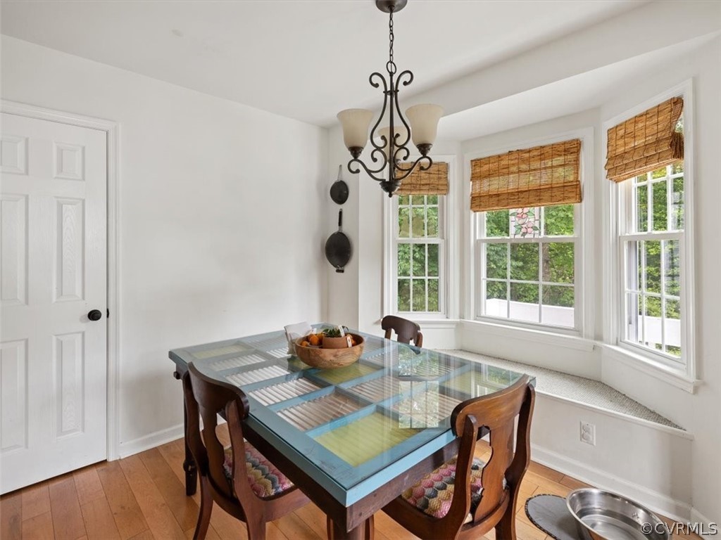 7107 Pointer Ridge Road Midlothian, VA 23112 - Photo 9 of 22 a view of a dining room with furniture window and wooden floor