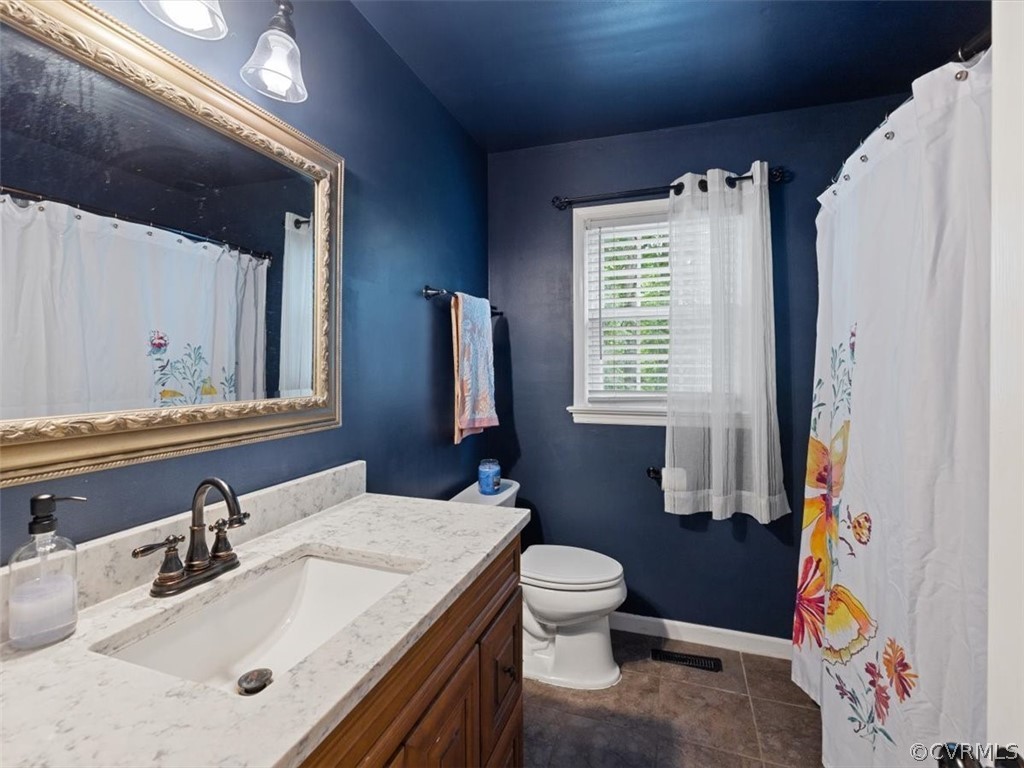 7107 Pointer Ridge Road Midlothian, VA 23112 - Photo 10 of 22 a bathroom with a sink a toilet and a mirror