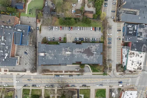a aerial view of a brick building with a outdoor space