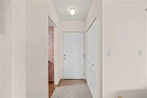 a kitchen with a stove a refrigerator and a sink