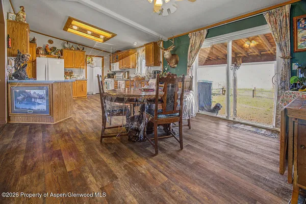 a view of a dining room with furniture window and wooden floor