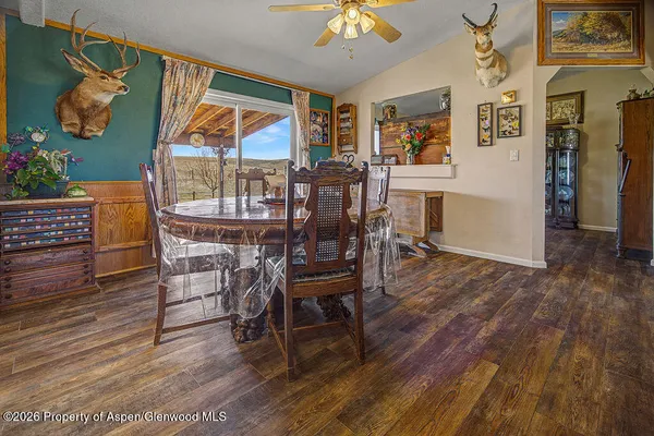 a view of a dining room with furniture window and wooden floor