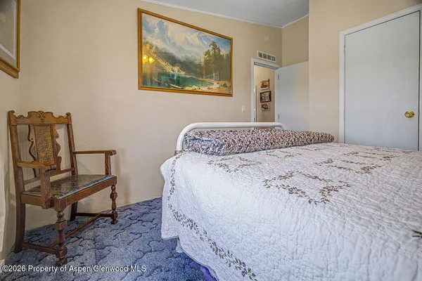 a bedroom with a bed and furniture