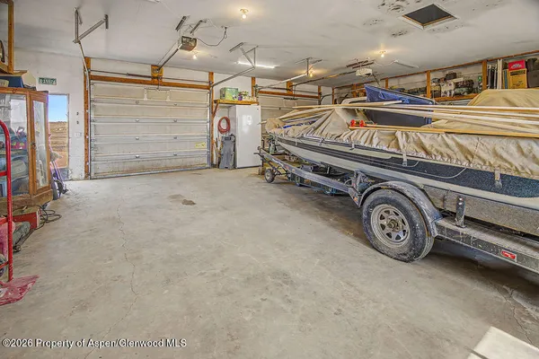 a view of parking garage with cars