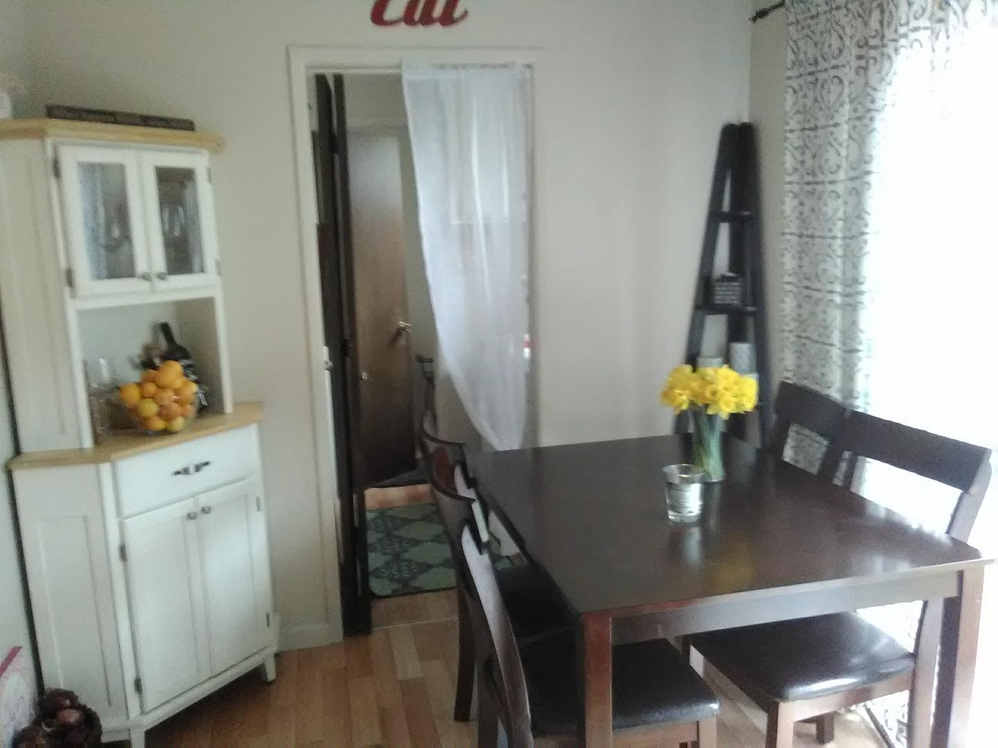 698 Danforth Drive Sunnyvale, CA 94087 - Photo 17 of 23 a view of a dining room with furniture and wooden floor