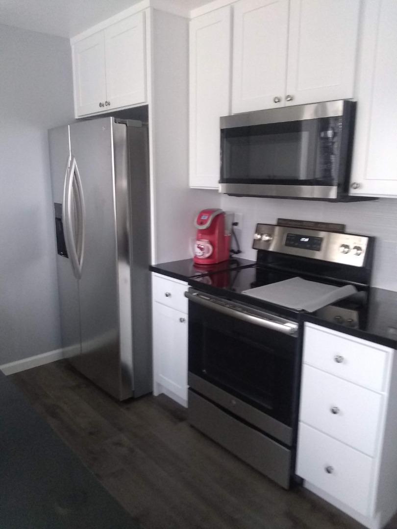 698 Danforth Drive Sunnyvale, CA 94087 - Photo 18 of 23 a kitchen with stainless steel appliances a stove microwave and refrigerator