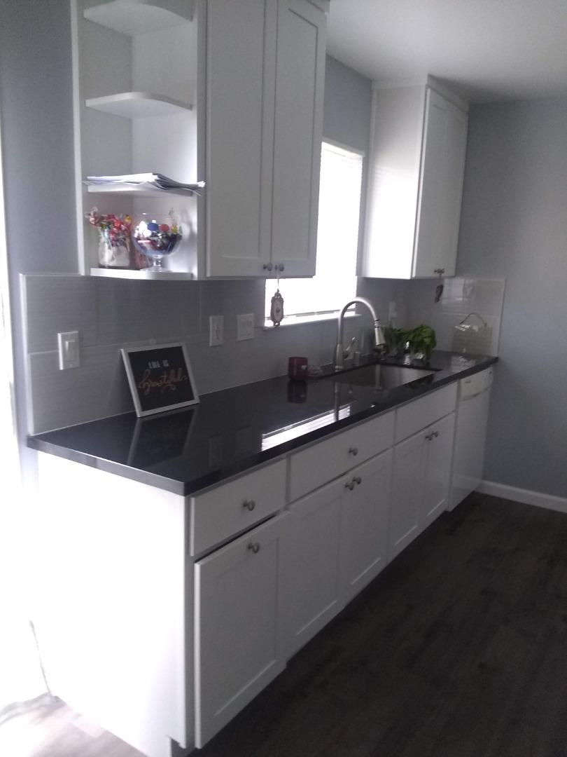 698 Danforth Drive Sunnyvale, CA 94087 - Photo 7 of 23 a kitchen with stainless steel appliances a sink and cabinets