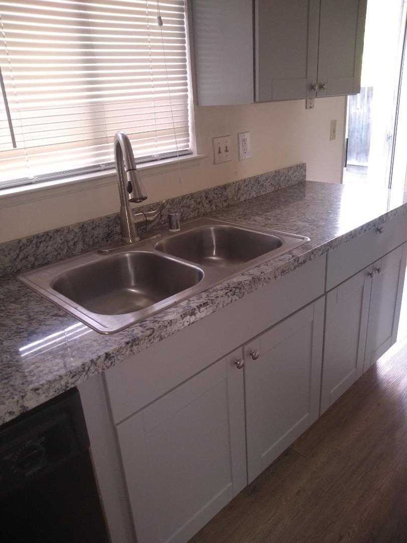 698 Danforth Drive Sunnyvale, CA 94087 - Photo 9 of 23 a kitchen with a sink cabinets and window