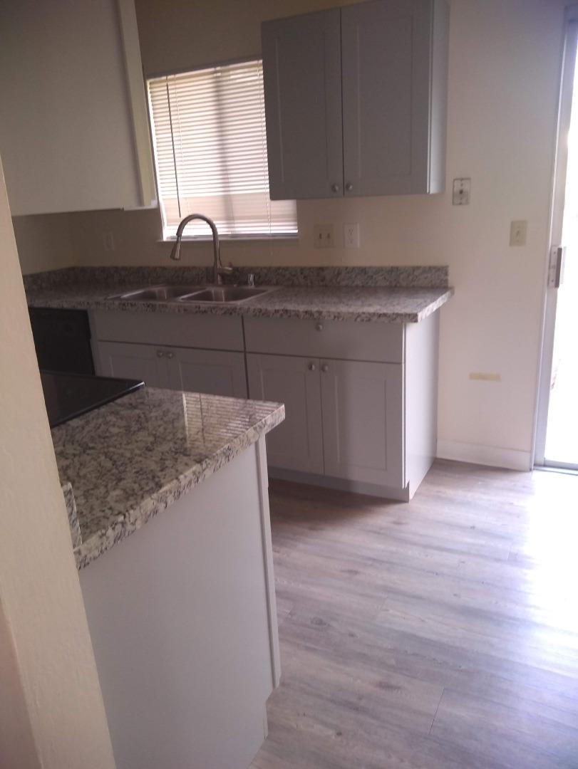 698 Danforth Drive Sunnyvale, CA 94087 - Photo 10 of 23 a kitchen with granite countertop a sink and a stove