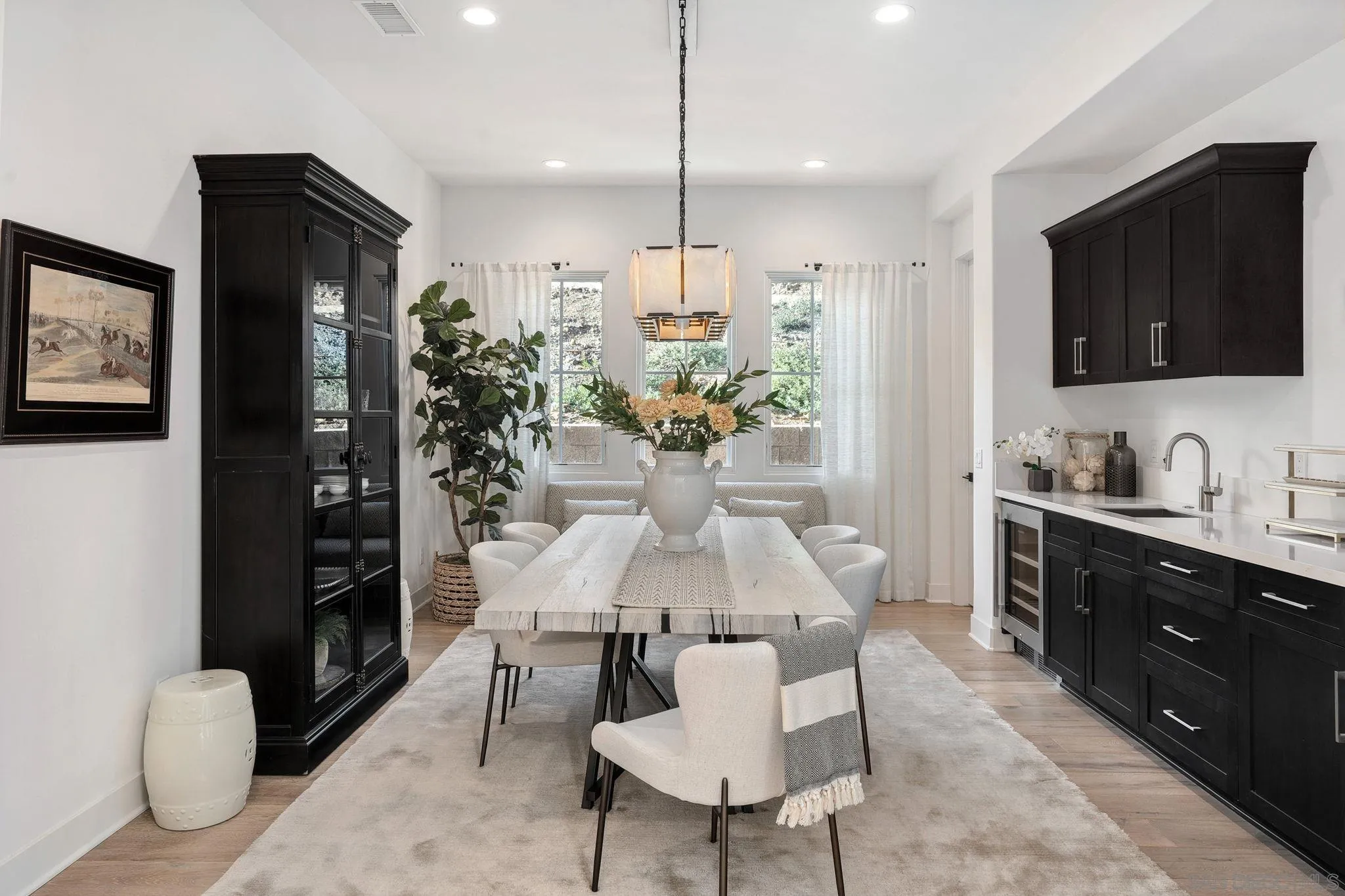 3801 Rancho Summit Drive Encinitas, CA 92024 - Photo 3 of 10 a kitchen with stainless steel appliances kitchen island granite countertop a refrigerator and a stove top oven