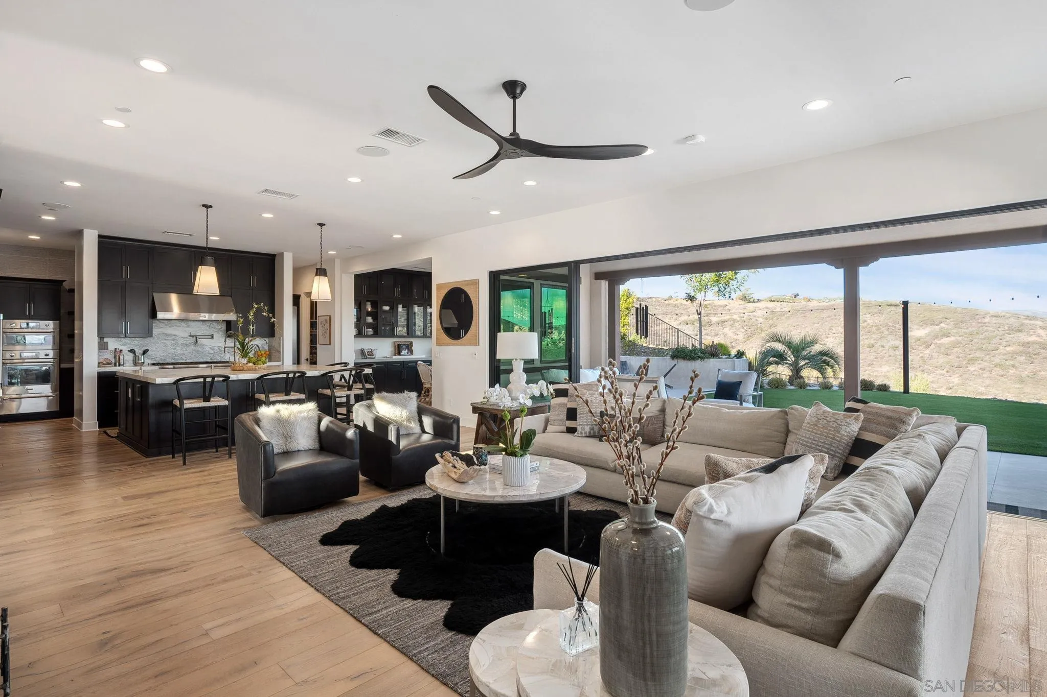 3801 Rancho Summit Drive Encinitas, CA 92024 - Photo 4 of 10 a living room with furniture and a large window