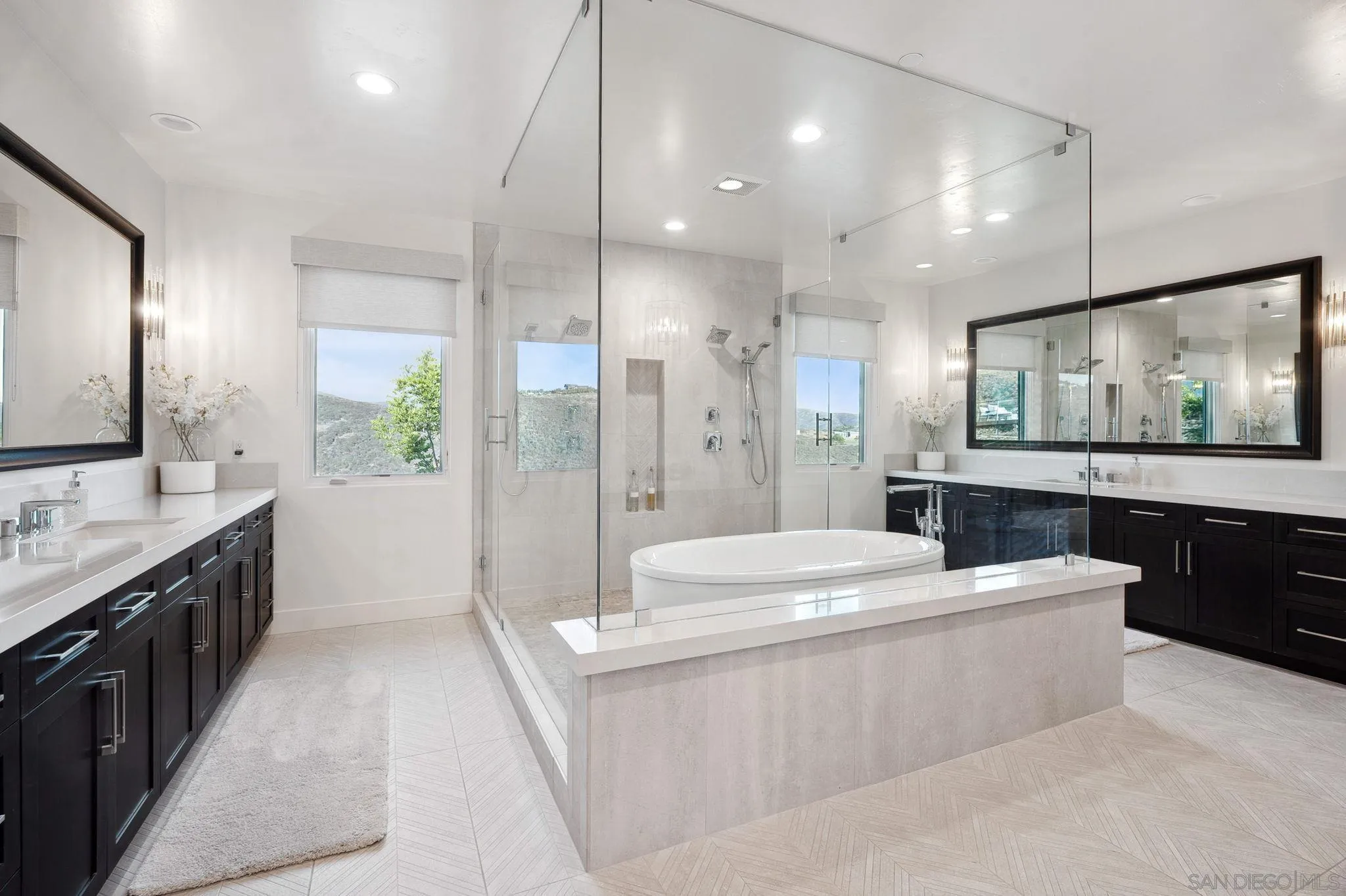 3801 Rancho Summit Drive Encinitas, CA 92024 - Photo 7 of 10 a large bathroom with a sink a large mirror and a shower