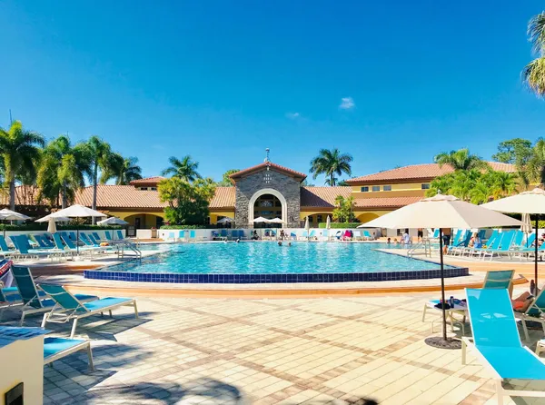 a view of a patio with table and chairs and potted plants