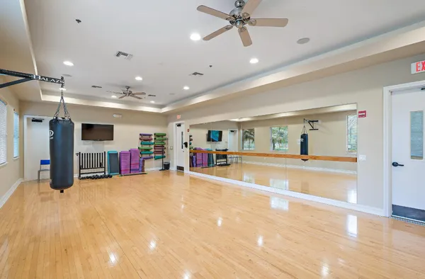 a living room with lots of gym equipment