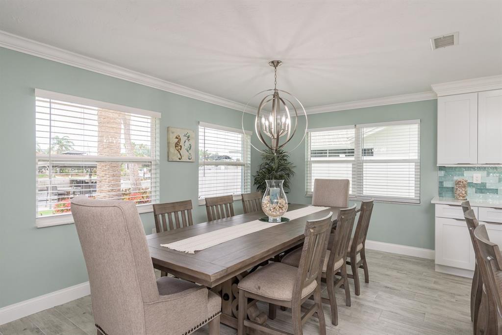 3301 Seaway Drive New Port Richey, FL 34652 - Photo 16 of 53 a view of a dining room with furniture window and wooden floor